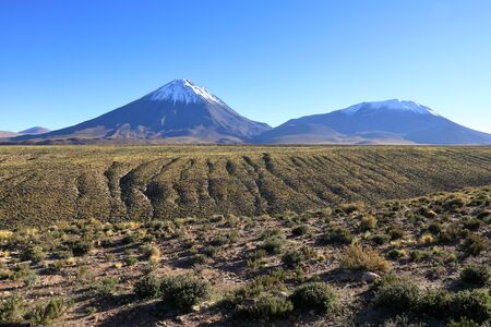 The panorama of the Lincancabur volcano in the Atacama desert from the side of Chileの写真素材