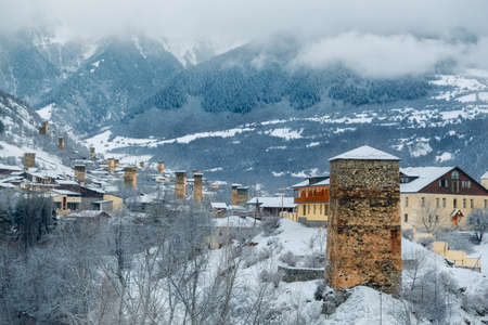 Svan towers covered with snow - beautiful town in winter, Mestia, Svaneti region, Georgiaの写真素材