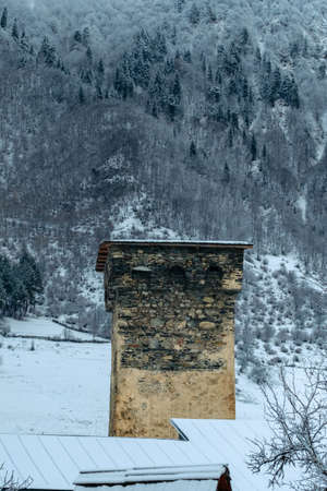 Svan towers covered with snow -  Mestia in winter, Svaneti region, Georgiaの写真素材