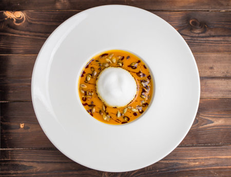 pumpkin soup with air foam and pumpkin seedsの写真素材