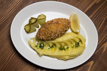 steak with mashed potatoes and pickled cucumberの写真素材