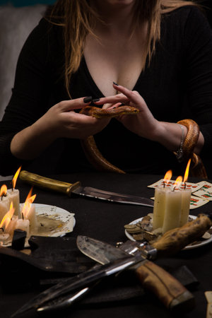 The ritual of black magic conducted with the help of a snakeの写真素材