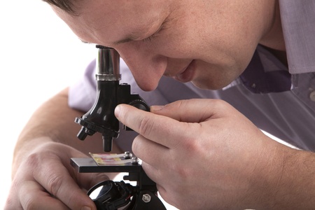 Portrait of a man with a microscopeの写真素材