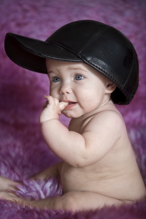 Image of a child sitting on purple furの写真素材