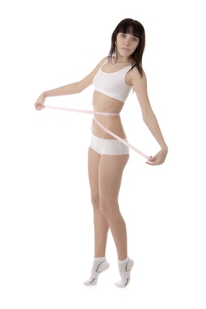 Image of a girl measuring her waistの写真素材