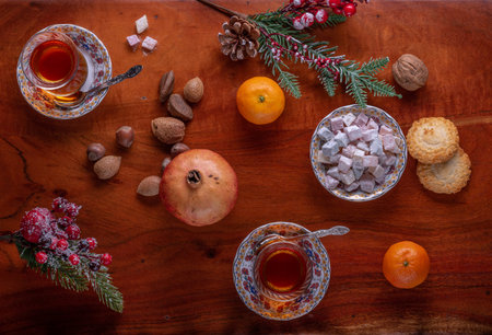 Tea and the Turkish delight on a table with selection of nuts and fruits