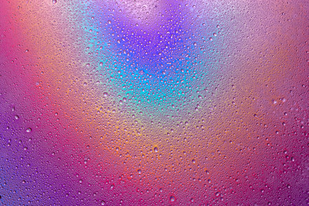 Background of drops of water on multicolor surface .
