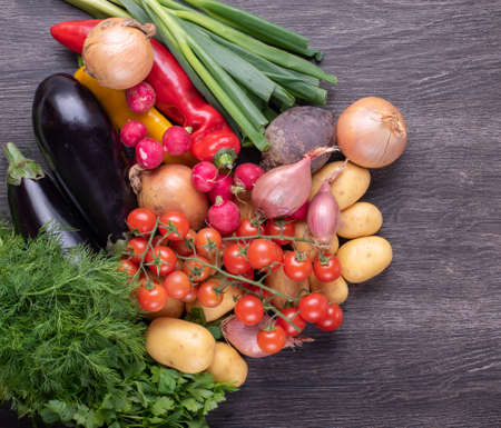 Fresh colorful organic vegetables on a rustic wooden table background, farming and healthy food concept.の写真素材