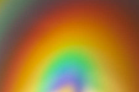 Reflection of multicolored lights ont plastic surface creating rainbow effect.の写真素材