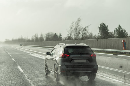 Bad visibility from the cab of a car on rainy day .