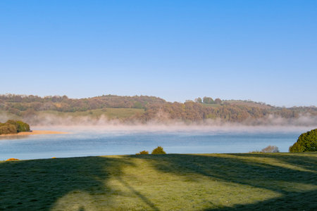 beautiful foggy sunrise over the lake of Lough Bawn in the midlands of Ireland.の写真素材