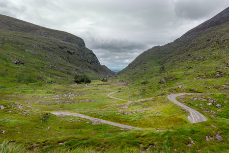 Beautiful mauntains landscape with winding road in the valley.の写真素材