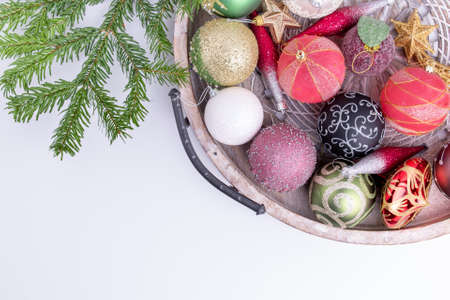 Set of Christmas decorations in wooden tray on white background. Holiday concept. Flat lay, top viewの写真素材