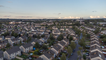 Aerial photo of housing estate in the Summer showing the tops of houses.の写真素材