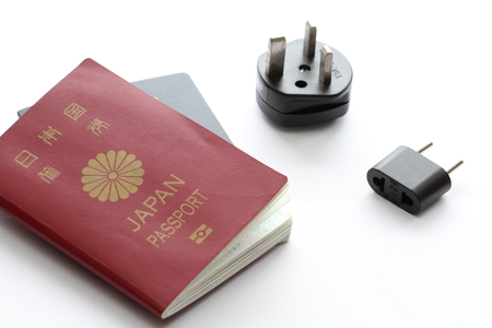 Japanese passport and electric plugの写真素材