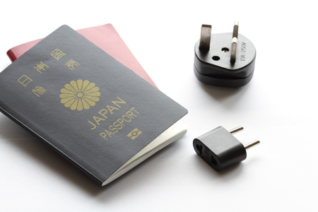 Japanese passport and electric plugの写真素材