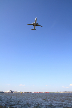Landing airplane and seaの写真素材