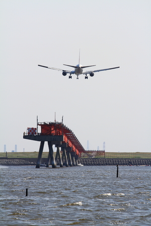 Landing airplane and seaの写真素材