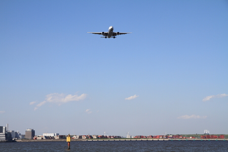 Landing airplane and seaの写真素材