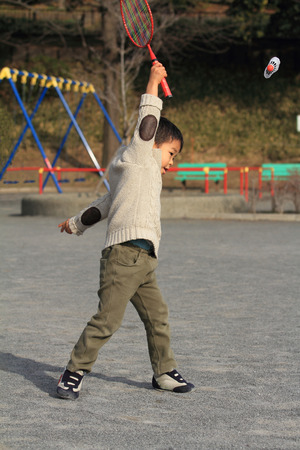 Japanese boy playing badmintonの写真素材