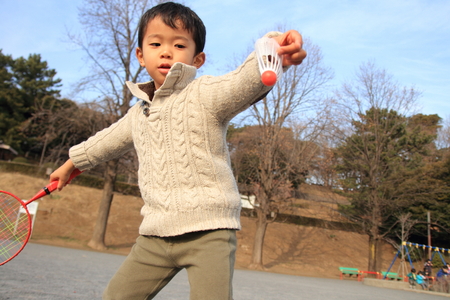 Japanese boy playing badmintonの写真素材