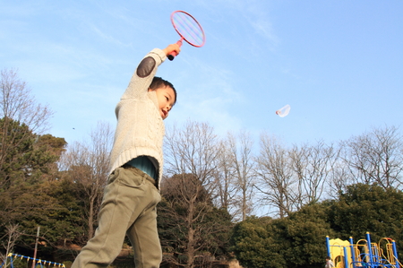 Japanese boy playing badmintonの写真素材