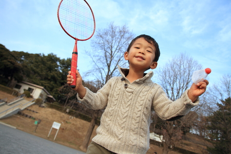 Japanese boy playing badmintonの写真素材