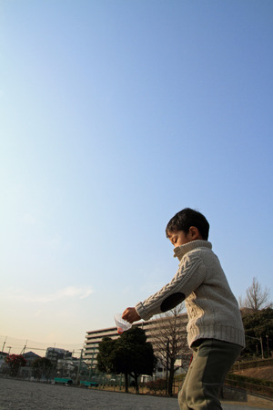 Japanese boy playing badmintonの写真素材