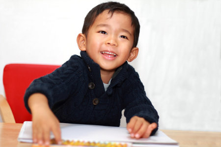 Japanese boy drawing a picture