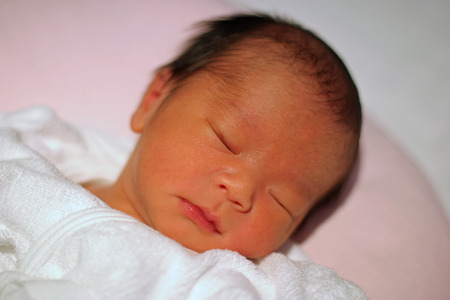 Sleeping newborn baby (Japanese boy)の写真素材