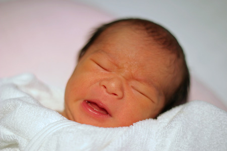 Crying newborn baby (Japanese boy)の写真素材