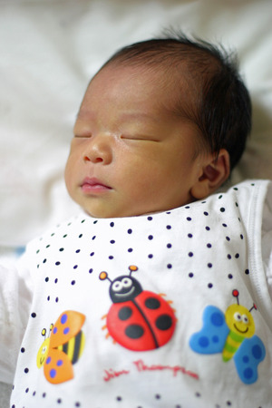 Sleeping newborn baby (Japanese boy)の写真素材