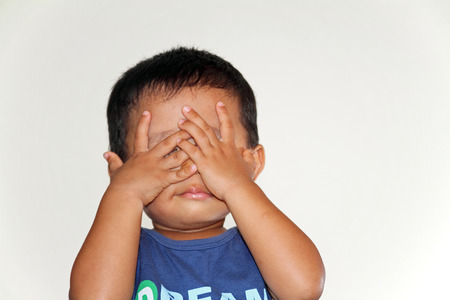 Japanese boy playing peek-a-booの写真素材