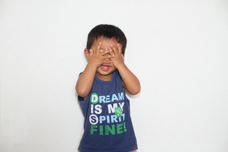 Japanese boy playing peek-a-booの写真素材