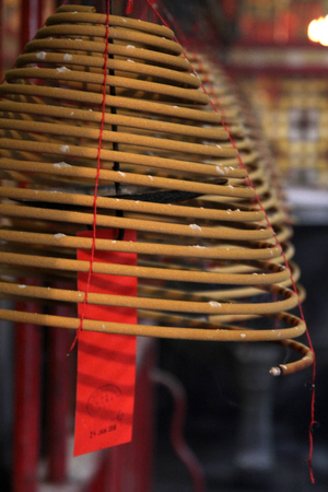 Spiral incense stick at Man Mo Temple in Hong Kongの写真素材