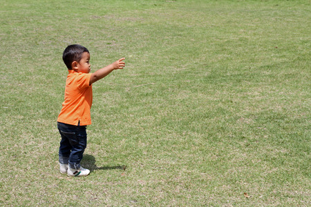 Japanese boy standing on the glassの写真素材