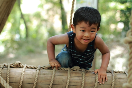 Japanese boy in athletic fieldの写真素材