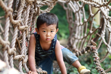 Japanese boy in athletic fieldの写真素材