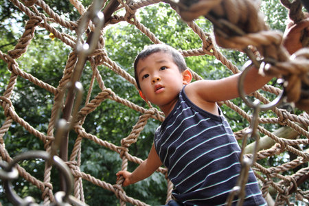 Japanese boy in athletic fieldの写真素材