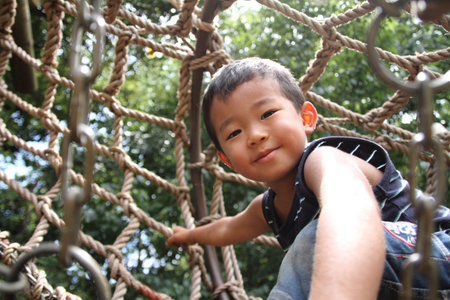 Japanese boy in athletic fieldの写真素材