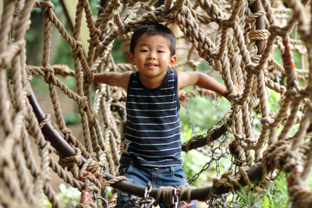 Japanese boy in athletic fieldの写真素材