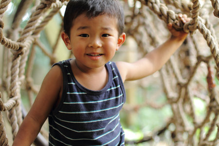 Japanese boy in athletic fieldの写真素材