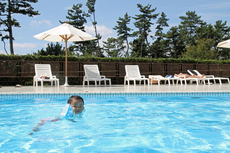 Japanese boy swiming in the pool (1 year old)のeditorial素材