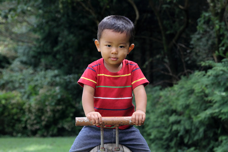 Japanese boy on the seesaw (2 years old)の写真素材