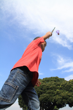 Japanese boy playing badminton (5 years old)の写真素材