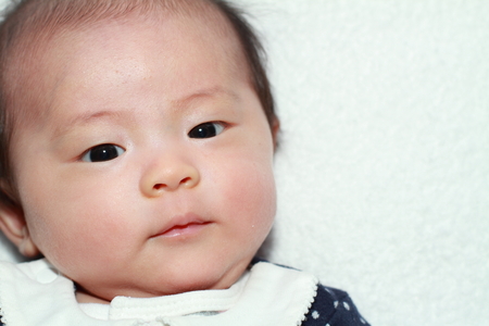 Smiling baby girl (Japanese 0 year old)の写真素材