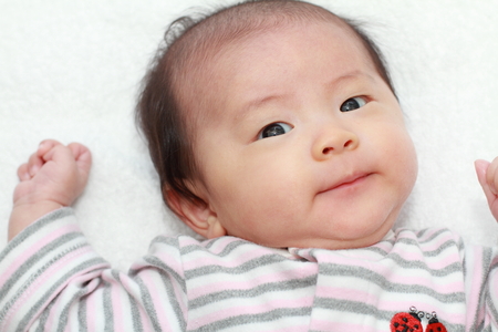 Smiling baby girl (Japanese 0 year old)の写真素材