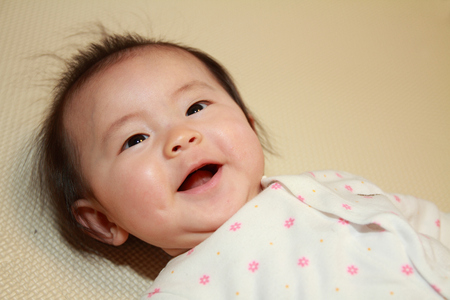 Smiling baby girl の写真素材