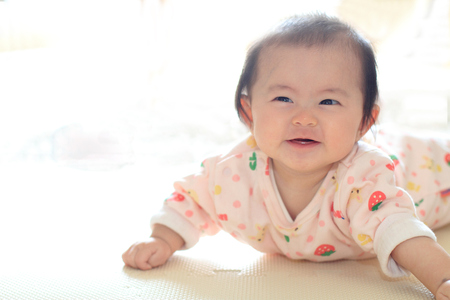 Crawling baby girl (Japanese baby)の写真素材
