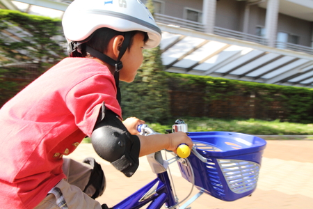 Japanese boy riding on the bicycle 5 years oldの写真素材